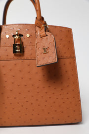 City Streamer PM Cognac Autruche Leather Handbag (Brand New)